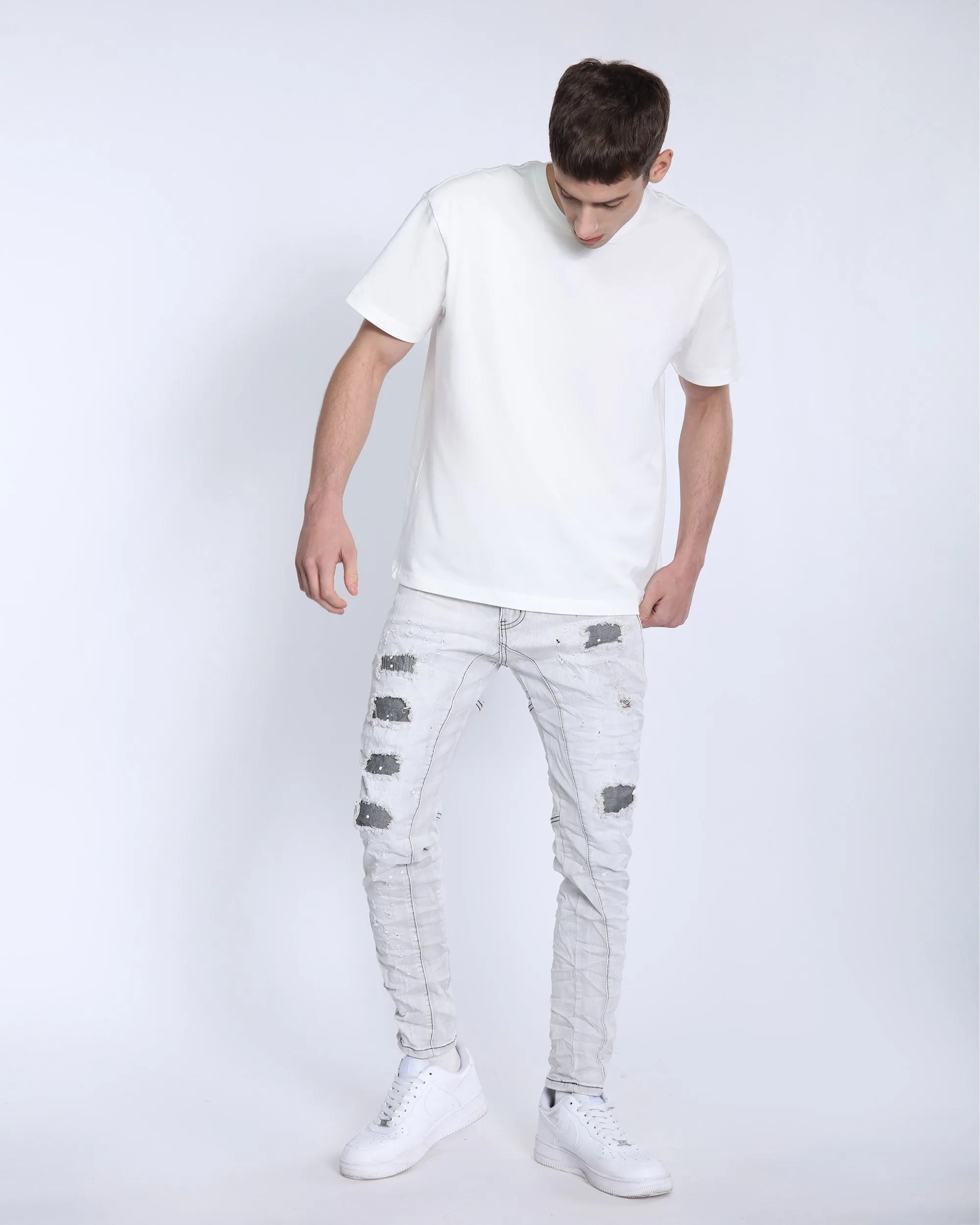 Slim Fit Gray Jeans with Rips, Patches, and Distressed Detailing